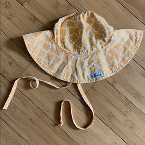Orange and white Flaphappy Sunhat.